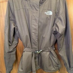 Gently used LG woman’s brown North Face jacket with hood.
